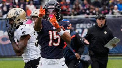Oct 19, 2025; Chicago, Illinois, USA; Chicago Bears wide receiver Rome Odunze (15) and New Orlenas Saints head coach Kellen Moore react after a Chicago first down during the first half at Soldier Field. Mandatory Credit: David Banks-Imagn Images