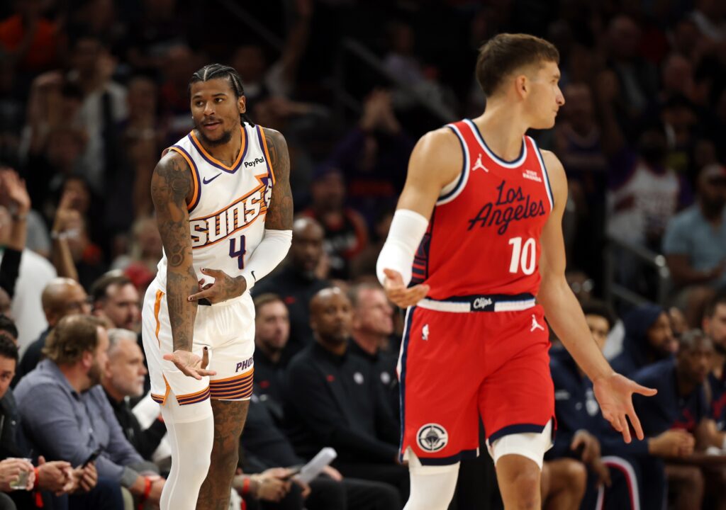 Nov 6, 2025; Phoenix, Arizona, USA; Phoenix Suns guard Jalen Green (4) celebrates a three point shot against the Los Angeles Clippers in the first half at the Mortgage Matchup Center. Mandatory Credit: Mark J. Rebilas-Imagn Images