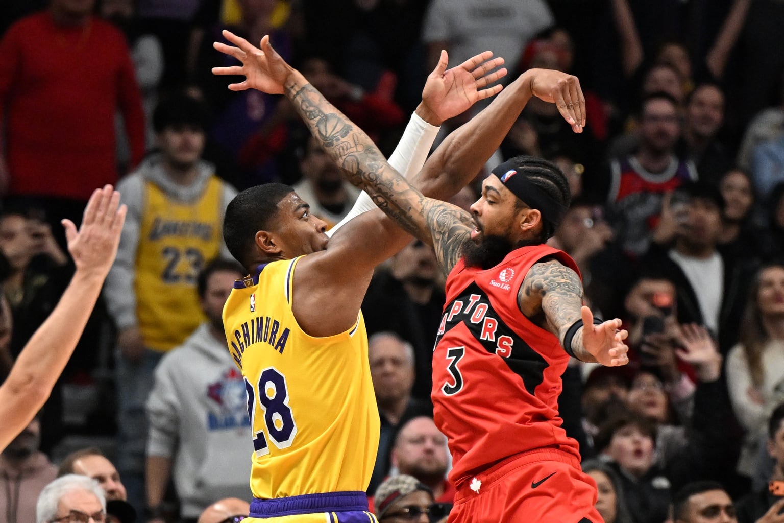 Dec 4, 2025; Toronto, Ontario, CAN; Los Angeles Lakers forward Rui Hachimura (28) shoots the game winning basket at the buzzer past Toronto Raptors forward Brandon Ingram (3) in the second half at Scotiabank Arena. Mandatory Credit: Dan Hamilton-Imagn Images