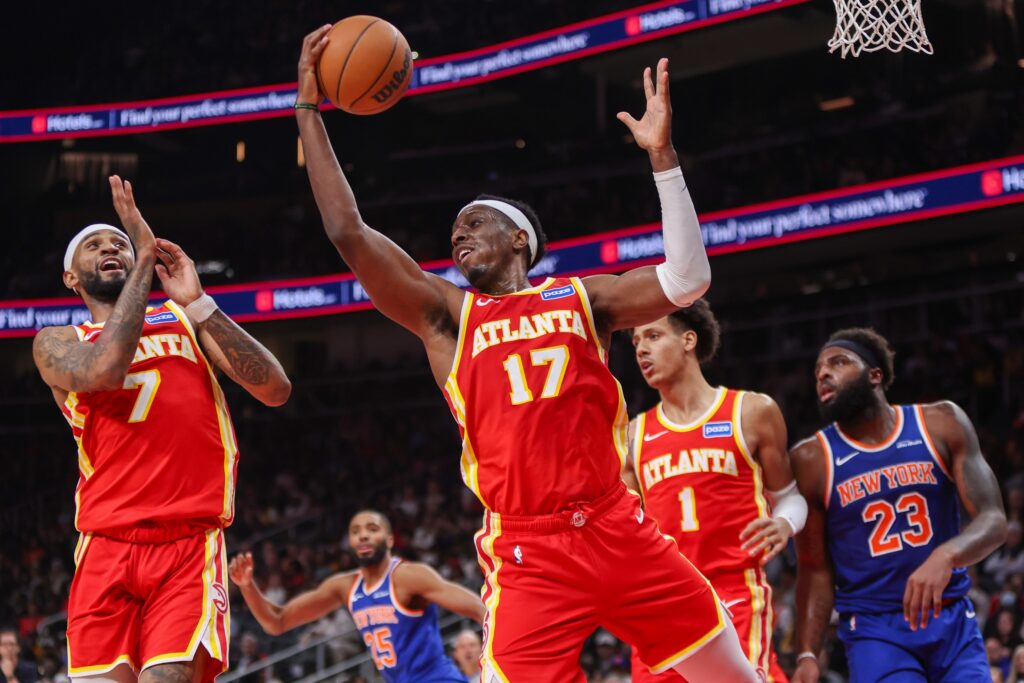 Dec 27, 2025; Atlanta, Georgia, USA; Atlanta Hawks forward Onyeka Okongwu (17) grabs a rebound against the New York Knicks in the second quarter at State Farm Arena. Mandatory Credit: Brett Davis-Imagn Images