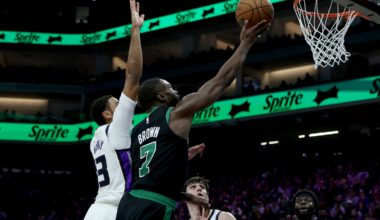 Jan 1, 2026; Sacramento, California, USA; Boston Celtics forward Jaylen Brown (7) goes up for a basket while defended by Sacramento Kings forward Keegan Murray (13) during the second quarter at Golden 1 Center. Mandatory Credit: Dennis Lee-Imagn Images