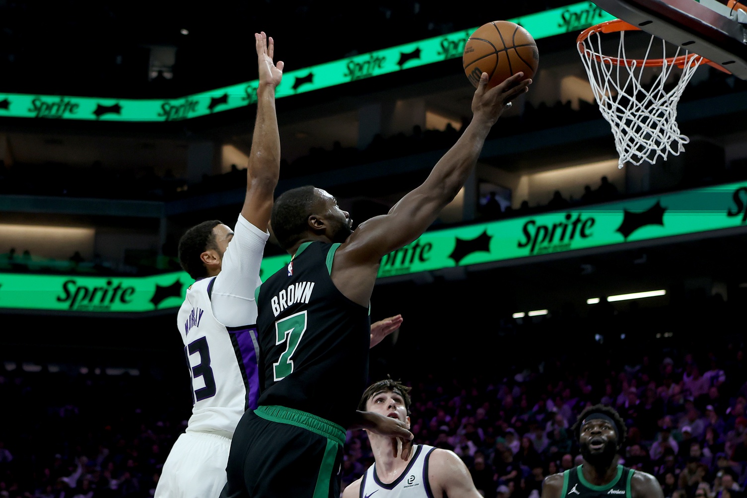 Jan 1, 2026; Sacramento, California, USA; Boston Celtics forward Jaylen Brown (7) goes up for a basket while defended by Sacramento Kings forward Keegan Murray (13) during the second quarter at Golden 1 Center. Mandatory Credit: Dennis Lee-Imagn Images