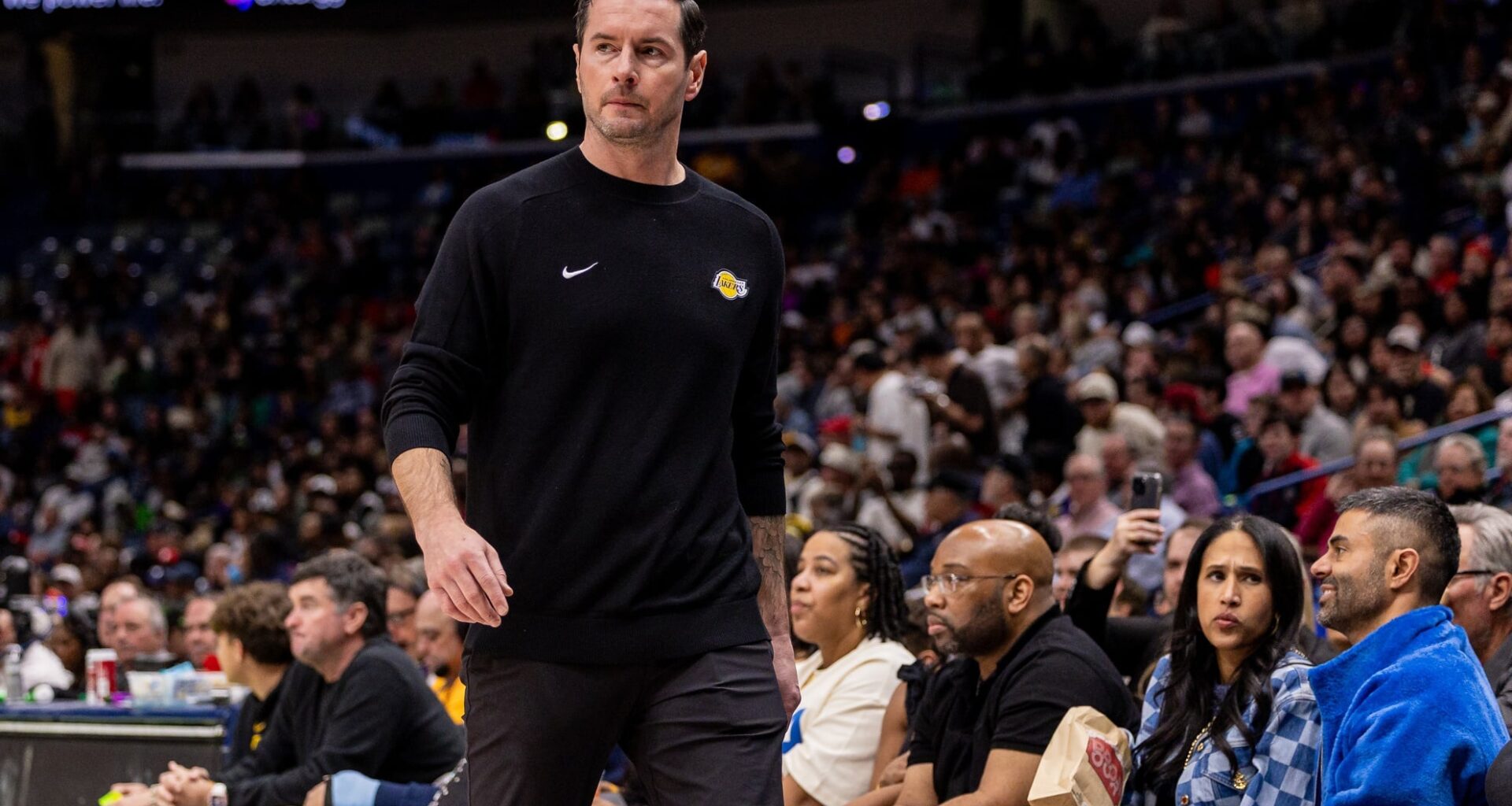 Jan 6, 2026; New Orleans, Louisiana, USA; Los Angeles Lakers Head Coach JJ Redick looks on against the New Orleans Pelicans during the first half at Smoothie King Center. Mandatory Credit: Stephen Lew-Imagn Images
