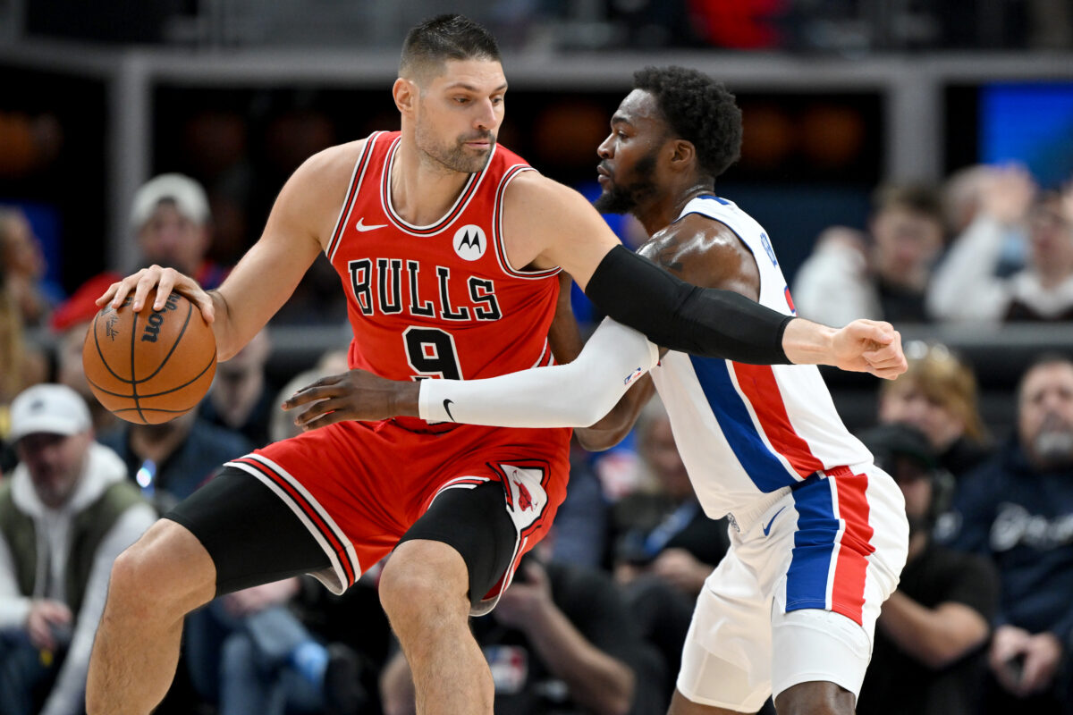 Jan 7, 2026; Detroit, Michigan, USA; Chicago Bulls center Nikola Vucevic (9) tries to drive to the basket against Detroit Pistons forward Paul Reed (7) in the second quarter at Little Caesars Arena. Mandatory Credit: Lon Horwedel-Imagn Images