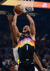 Jan 9, 2026; Phoenix, Arizona, USA; Phoenix Suns guard Devin Booker (1) drives to the basket against the New York Knicks in the first half at Mortgage Matchup Center. Mandatory Credit: Mark J. Rebilas-Imagn Images