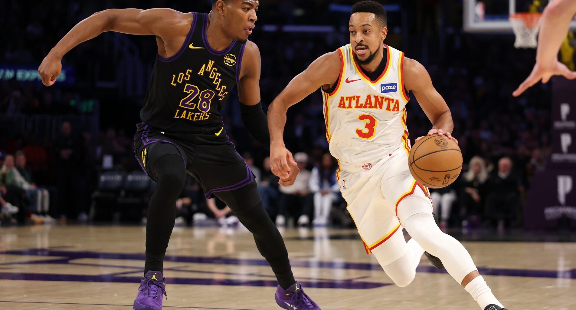 Atlanta Hawks guard CJ McCollum (3) drives to the basket against Los Angeles Lakers forward Rui Hachimura (28) during the first half at Crypto.com Arena.