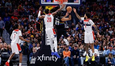Jan 17, 2026; Denver, Colorado, USA; Denver Nuggets guard Jamal Murray (27) drives to the net against Washington Wizards center Alex Sarr (20) and forward Justin Champagnie (9) in the third quarter at Ball Arena. Mandatory Credit: Isaiah J. Downing-Imagn Images
