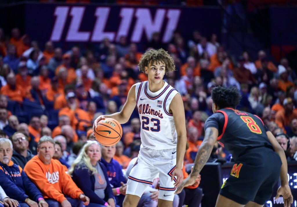  Illinois Fighting Illini guard Keaton Wagler (23) brings the ball up against Maryland Terrapins guard David Coit (8) in the first half at State Farm Center.