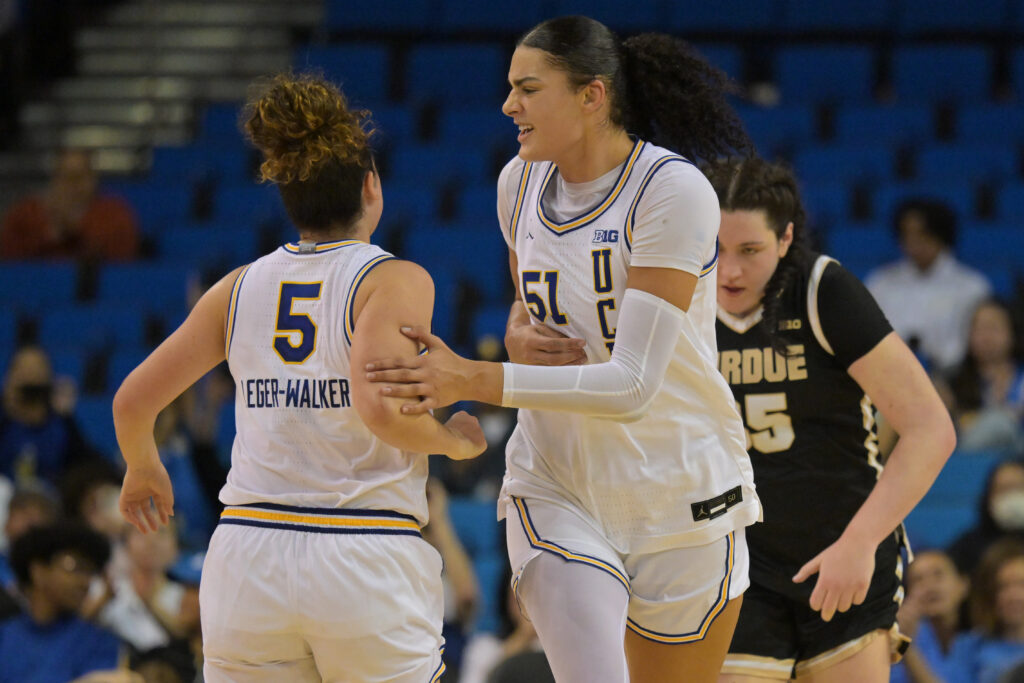 UCLA Bruins center Lauren Betts congratulates guard Charlisse Leger-Walker