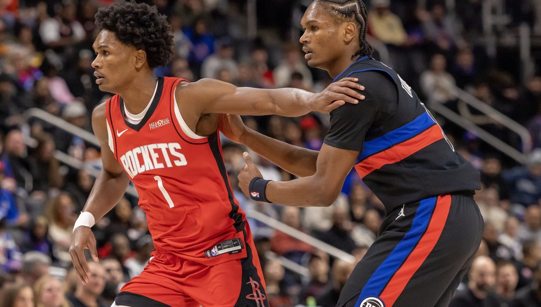 Detroit Pistons guard Ausar Thompson (9) defends against his twin brother, Houston Rockets guard Amen Thompson (1) during the first half at Little Caesars Arena.