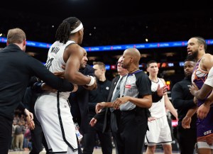 Jan 27, 2026; Phoenix, Arizona, USA; Brooklyn Nets guard Terance Mann (14) is separated from Phoenix Suns forward Dillon Brooks (3) during a fight in the second half at Mortgage Matchup Center. Mandatory Credit: Mark J. Rebilas-Imagn Images