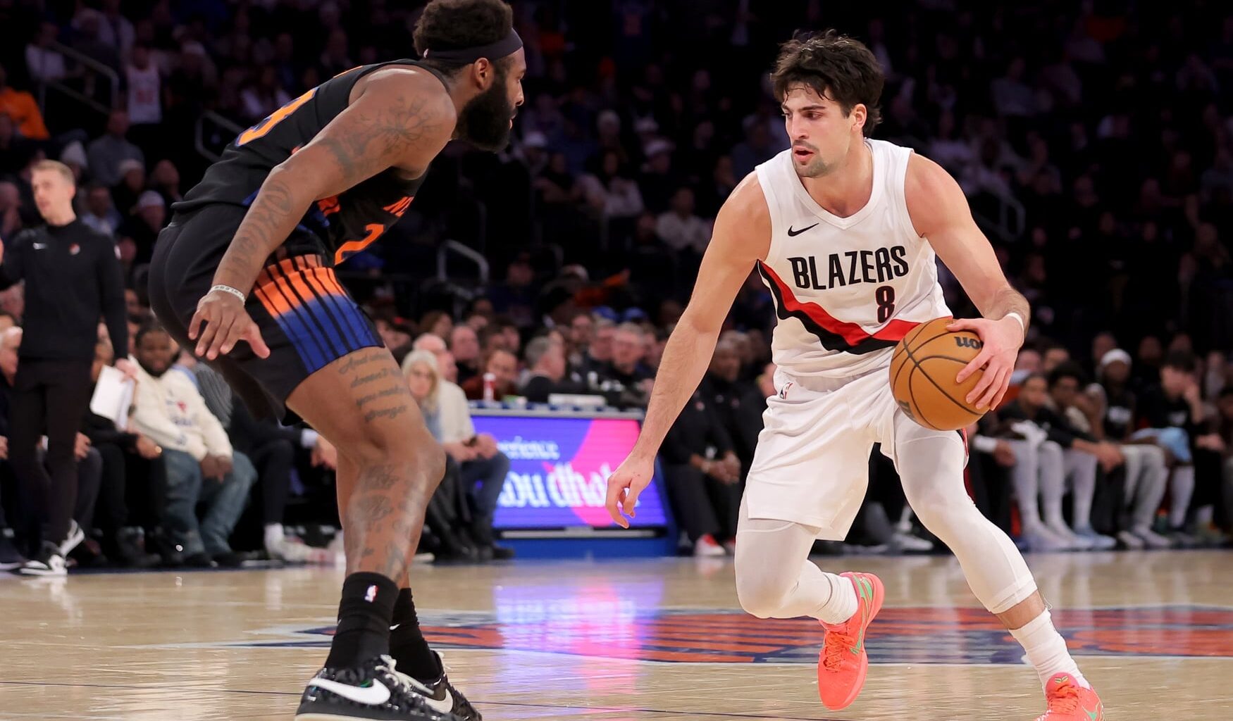 Jan 30, 2026; New York, New York, USA; Portland Trail Blazers forward Deni Avdija (8) controls the ball against New York Knicks center Mitchell Robinson (23) during the fourth quarter at Madison Square Garden. Mandatory Credit: Brad Penner-Imagn Images