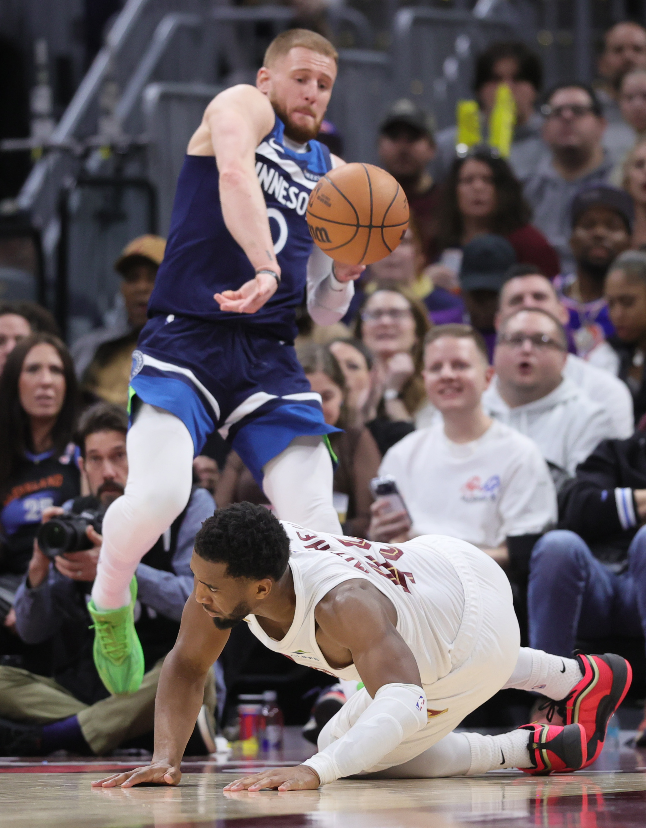 Minnesota Timberwolves guard Donte DiVincenzo throws the basketball at Cleveland Cavaliers guard Donovan Mitchell before he goes out of bounds in the second half. 