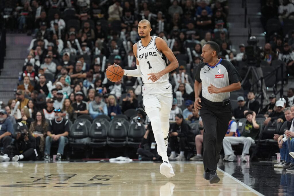 Jan 19, 2026; San Antonio, Texas, USA; San Antonio Spurs forward Victor Wembanyama (1) brings the ball up court against the Utah Jazz during the second half at Frost Bank Center. Mandatory Credit: Daniel Dunn-Imagn Images