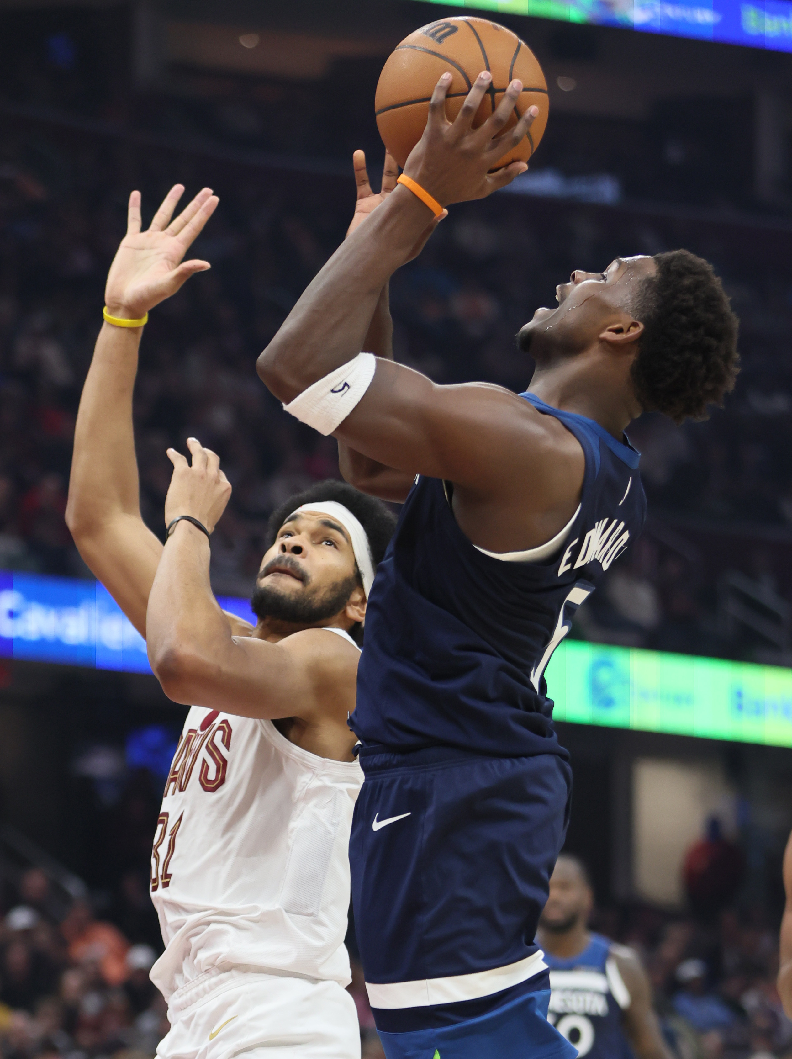 Minnesota Timberwolves guard Anthony Edwards takes a shot attempt guarded by Cleveland Cavaliers center Jarrett Allen in the first half at Rocket Arena. 