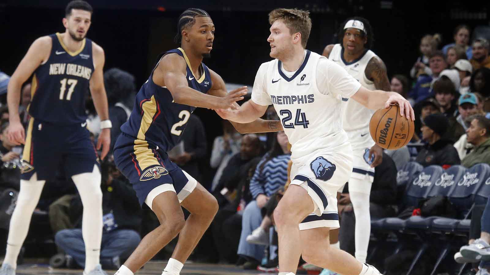 New Orleans Pelicans forward Trey Murphy III (25) shoots as Memphis Grizzlies forward Cedric Coward (23) defends during the second quarter at FedExForum.