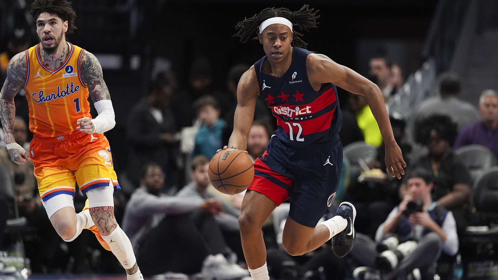 Washington Wizards guard Tre Johnson (12) brings the ball up court against the Charlotte Hornets during the first quarter at the Spectrum Center. 