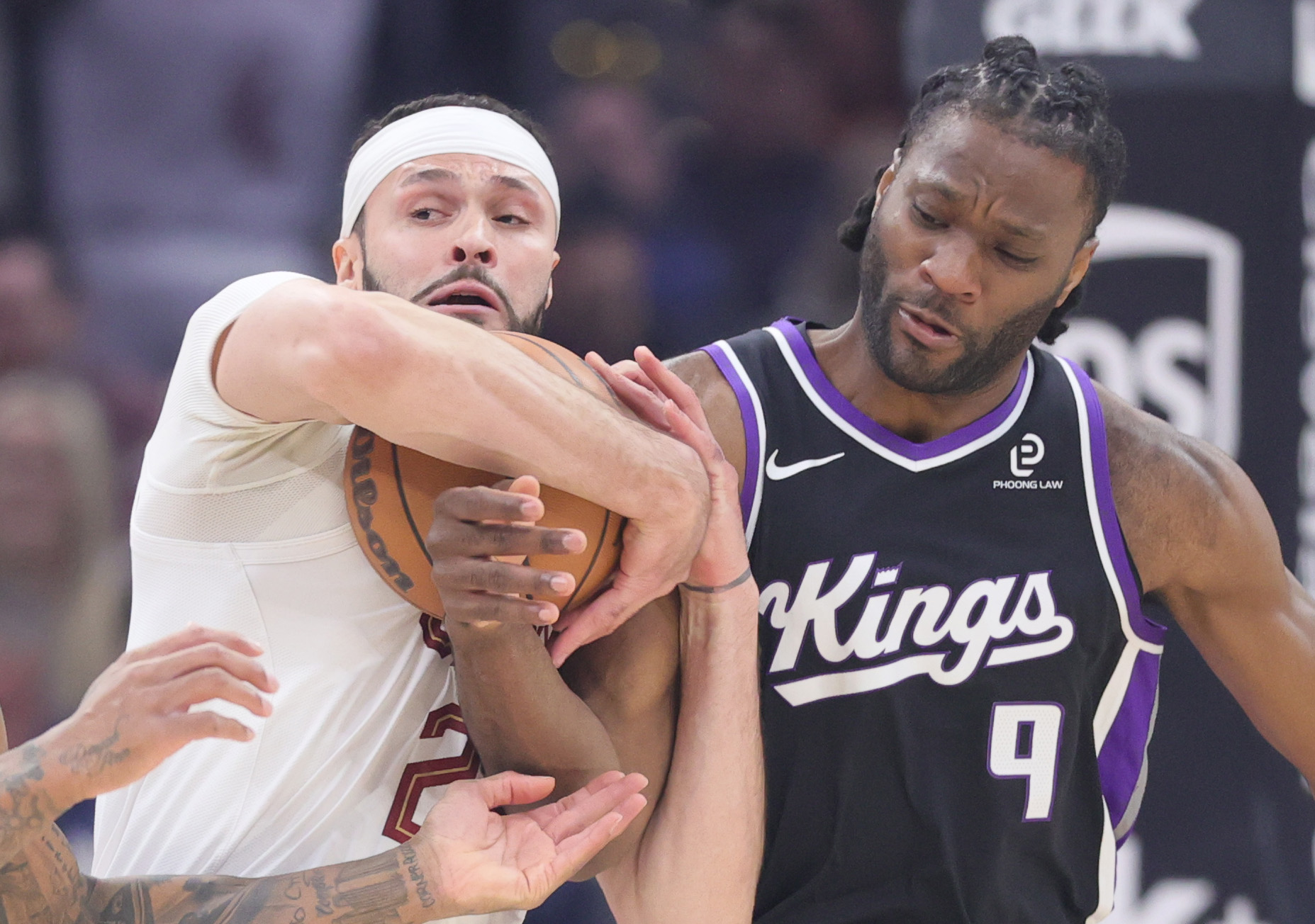 Cleveland Cavaliers forward Larry Nance Jr. (L) battles Sacramento Kings forward Precious Achiuwa for possession of a loose ball in the first half at Rocket Arena. 
