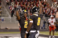 Forney's Javian Osborne (2) celebrates with his teammate quarterback Nelson Peterson, Jr....