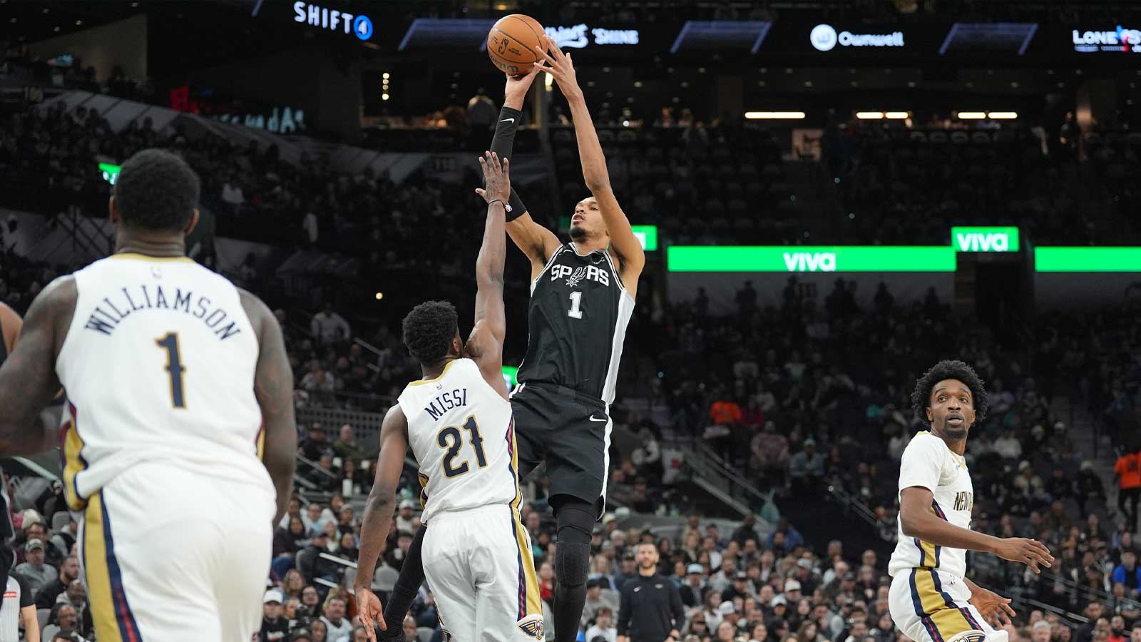 San Antonio Spurs forward Victor Wembanyama (1) shoots over New Orleans Pelicans center Yves Missi (21) in the first half at Frost Bank Center.