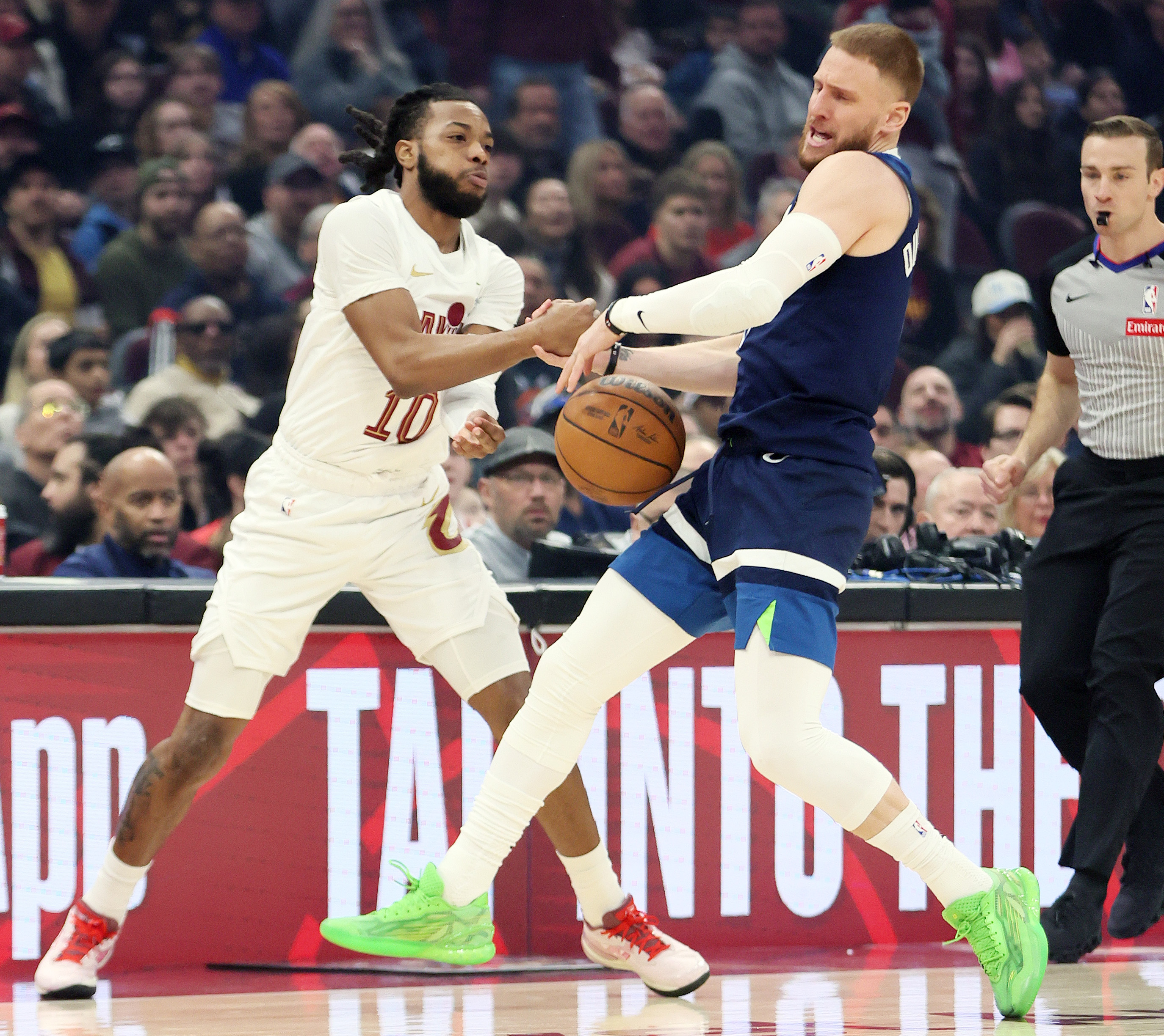 Cleveland Cavaliers guard Darius Garland (L) pokes the basketball free from the hands of Minnesota Timberwolves guard Donte DiVincenzo in the first half at Rocket Arena. 