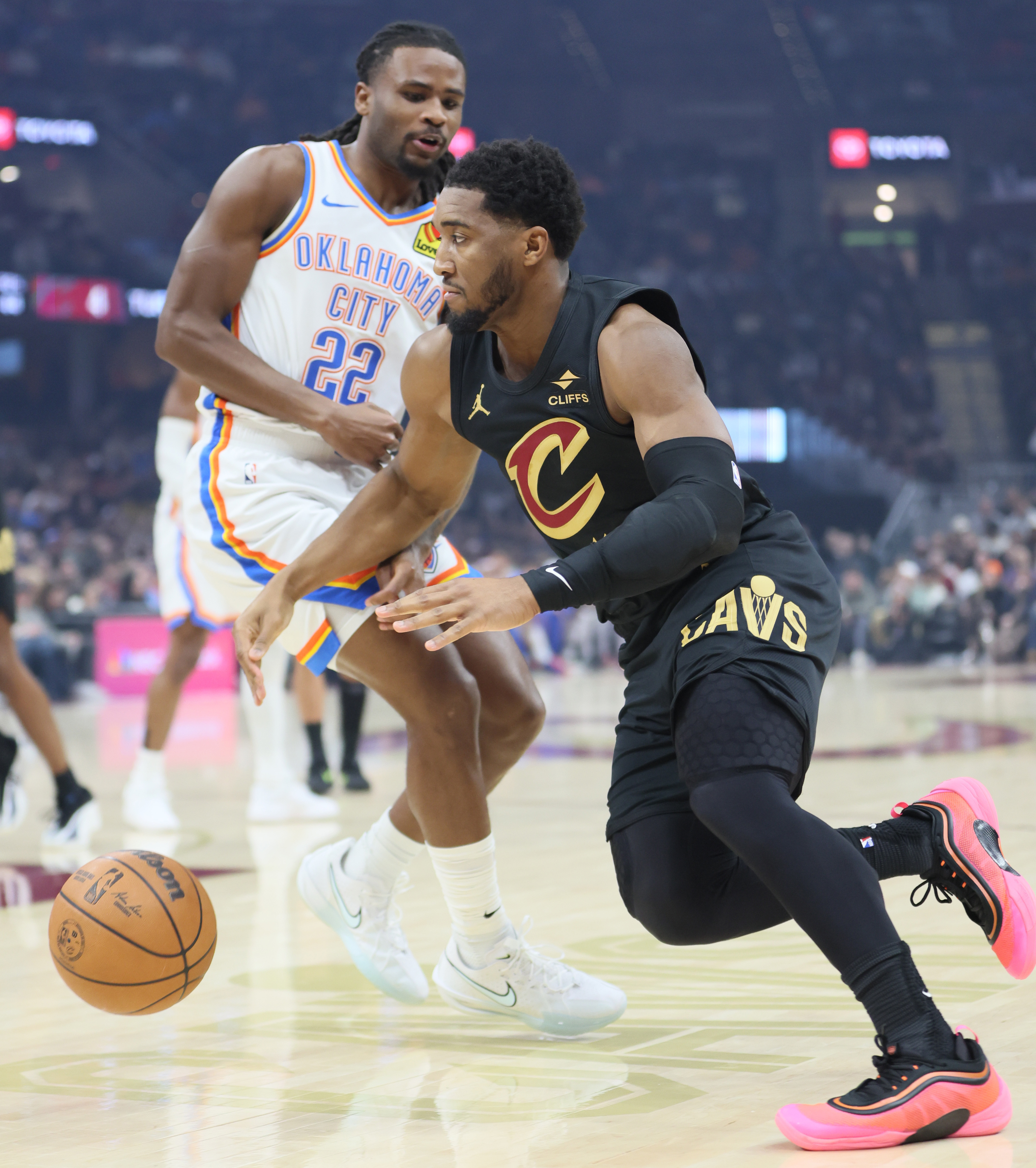 Cleveland Cavaliers guard Donovan Mitchell drives towards the basket guarded by Oklahoma City Thunder guard Cason Wallace in the first quarter at Rocket Arena. 