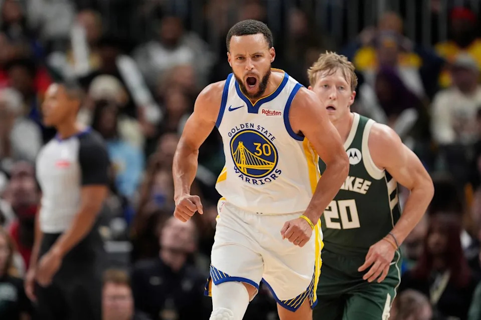 Stephen Curry celebrates after making a three-pointer against the Milwaukee Bucks. Getty Images