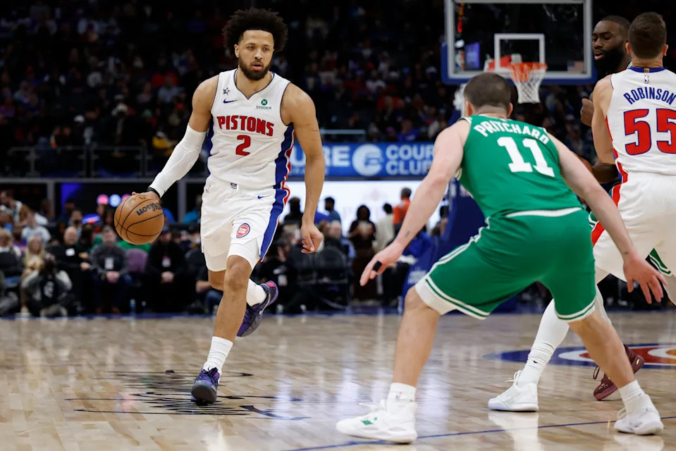 Jan 19, 2026; Detroit, Michigan, USA; Detroit Pistons guard Cade Cunningham (2) dribbles the ball against Boston Celtics guard Payton Pritchard (11) in the second half at Little Caesars Arena. Mandatory Credit: Rick Osentoski-Imagn Images