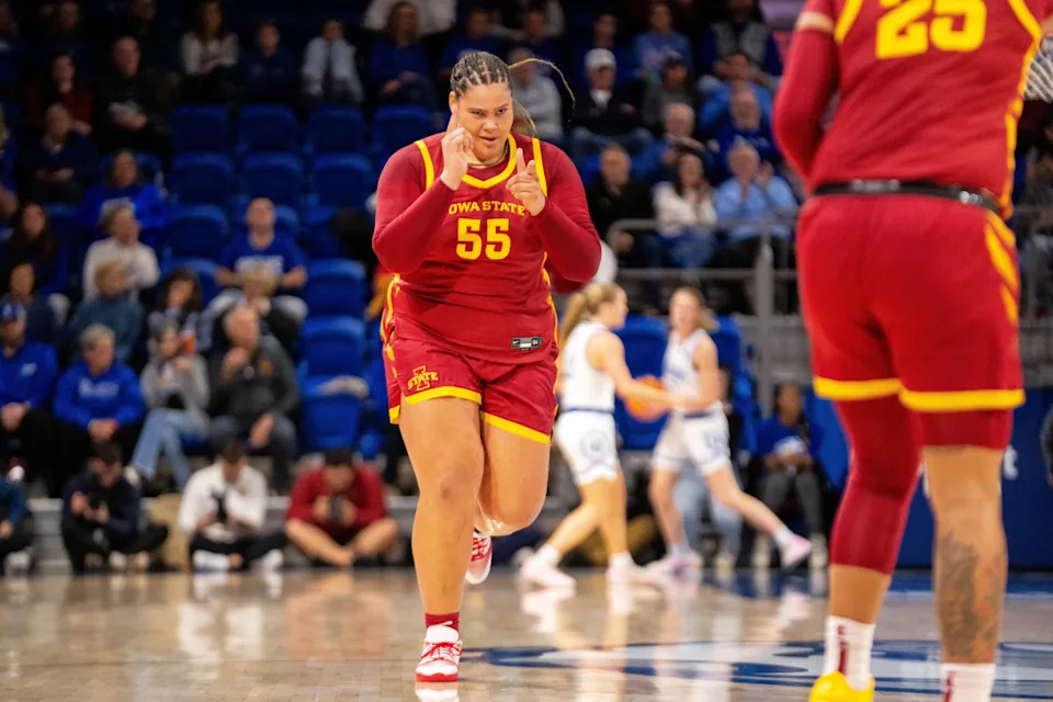 Iowa State's Audi Crooks (55) celebrates a basket.