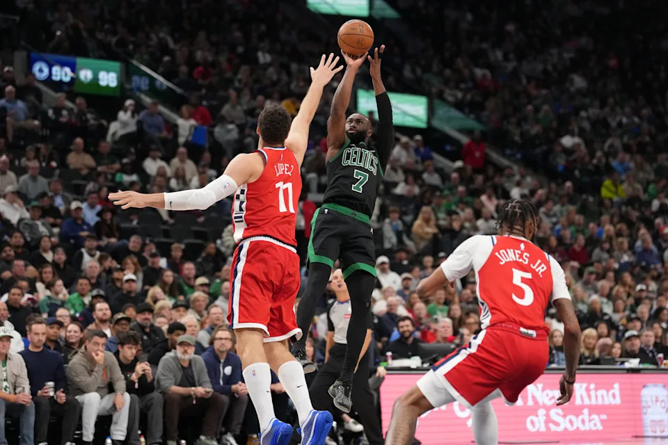 Jan 3, 2026; Inglewood, California, USA; Boston Celtics guard Jaylen Brown (7) shoots the ball against LA Clippers center Brook Lopez (11) and forward Derrick Jones Jr. (5) in the second half at Intuit Dome. Mandatory Credit: Kirby Lee-Imagn Images