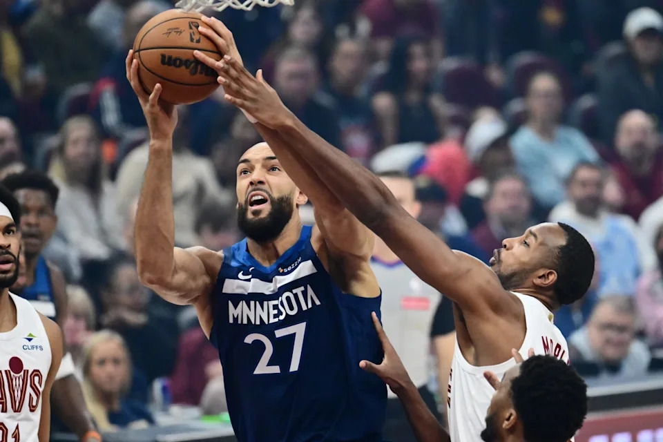 Minnesota Timberwolves center Rudy Gobert (27) drives to the basket against Cleveland Cavaliers forward Evan Mobley (4) on Jan. 10, 2026, in Cleveland.