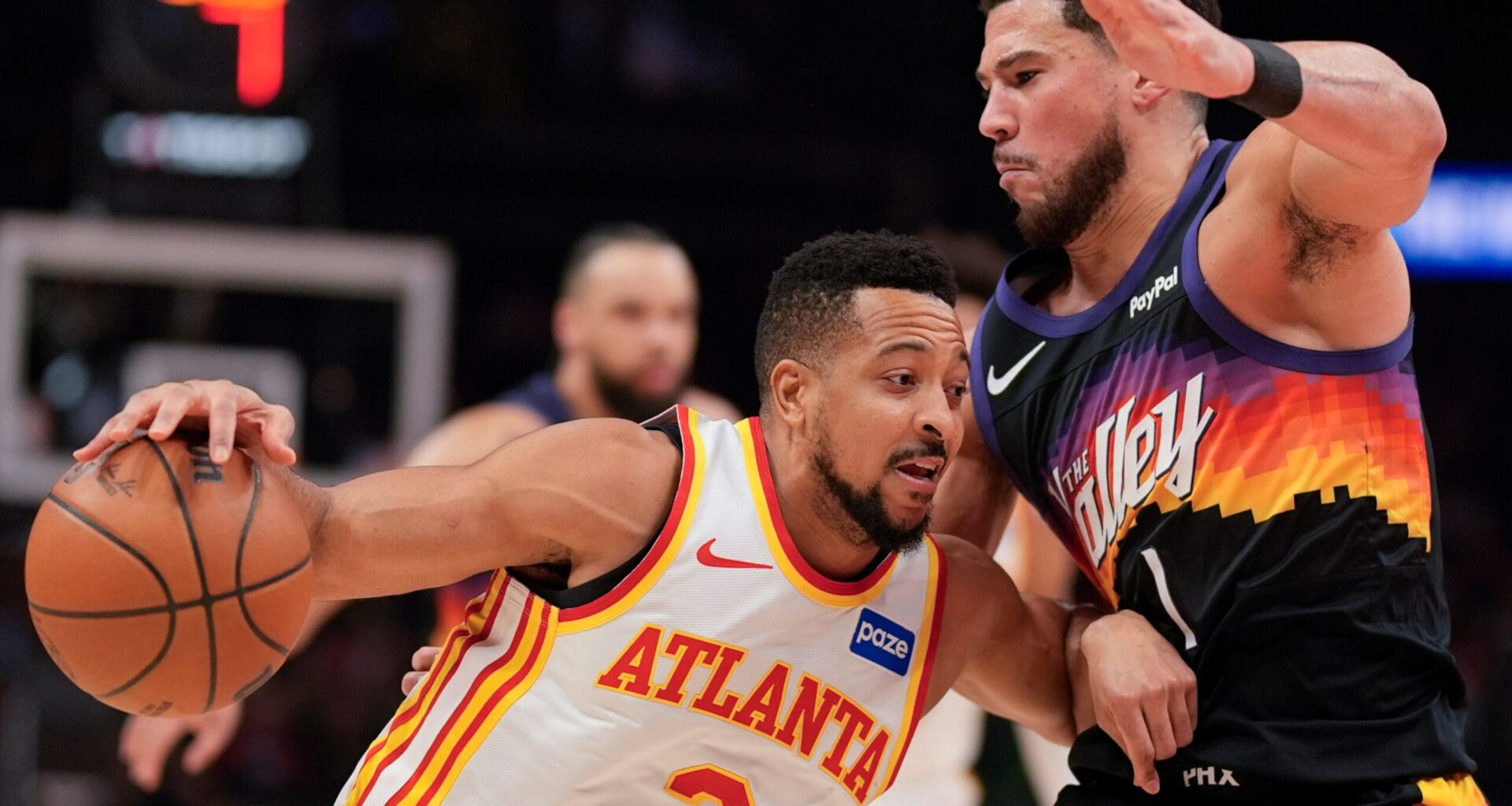 Suns’ Devin Booker rolls his ankle and Jalen Green also hurt in loss to Hawks