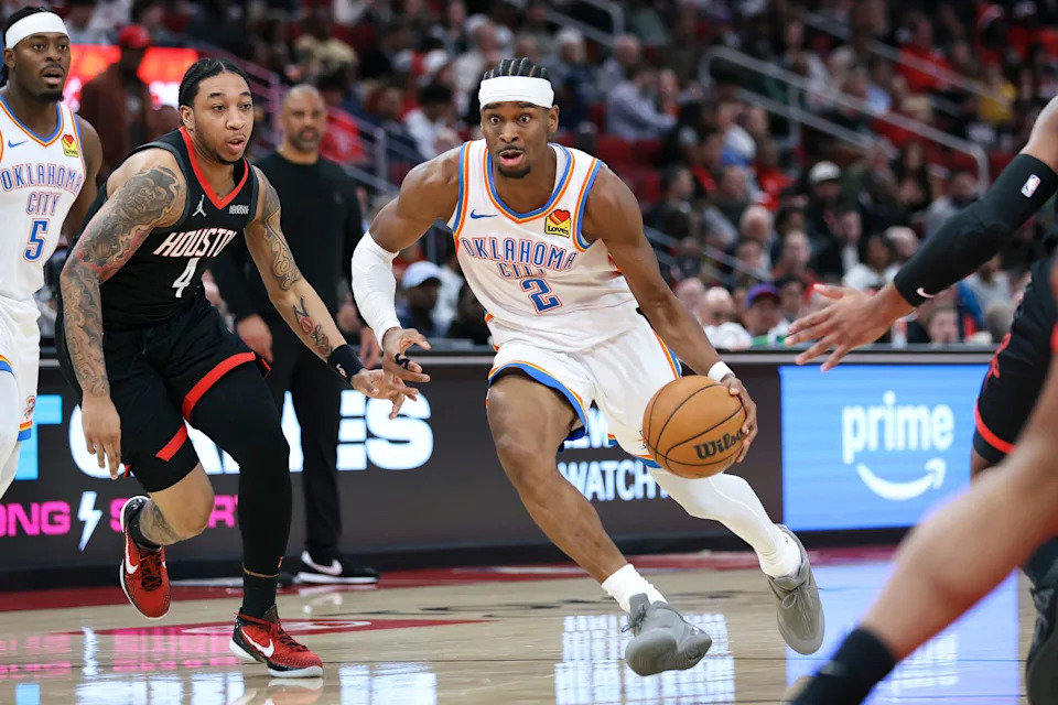Jan 15, 2026; Houston, Texas, USA; Oklahoma City Thunder guard Shai Gilgeous-Alexander (2) dribbles the ball as Houston Rockets guard JD Davison (4) defends during the third quarter at Toyota Center. Mandatory Credit: Troy Taormina-Imagn Images