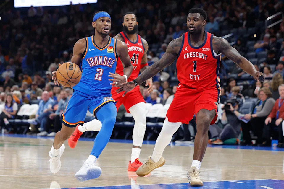 Jan 27, 2026; Oklahoma City, Oklahoma, USA; Oklahoma City Thunder guard Shai Gilgeous-Alexander (2) drives to the basket beside New Orleans Pelicans forward Zion Williamson (1) during the second half at Paycom Center. Mandatory Credit: Alonzo Adams-Imagn Images