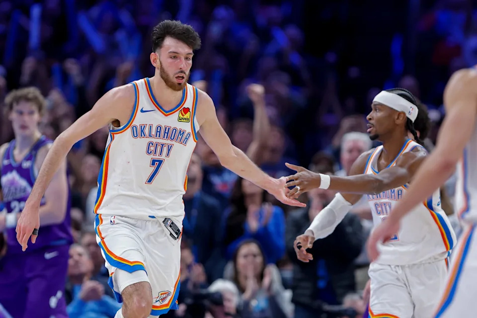 Jan 7, 2026; Oklahoma City, Oklahoma, USA; Oklahoma City Thunder center/forward Chet Holmgren (7) and Oklahoma City Thunder guard Shai Gilgeous-Alexander (2) celebrate after a basket during overtime against the Utah Jazz at Paycom Center. Mandatory Credit: Alonzo Adams-Imagn Images
