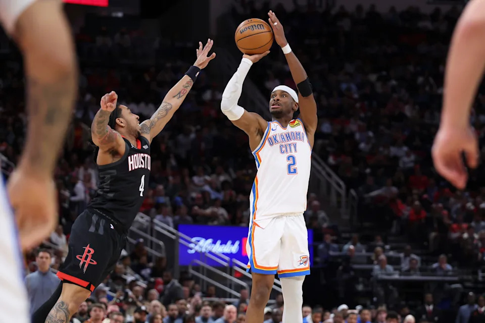 Jan 15, 2026; Houston, Texas, USA; Oklahoma City Thunder guard Shai Gilgeous-Alexander (2) shoots the ball as Houston Rockets guard JD Davison (4) defends during the third quarter at Toyota Center. Mandatory Credit: Troy Taormina-Imagn Images