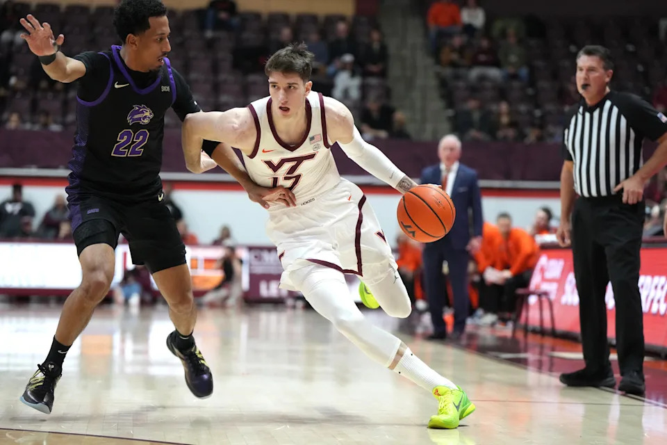 BLACKSBURG, VA.- DECEMBER 11: Neoklis Avdalas #17 of the Virginia Tech Hokies dribbles by Tidjiane Dioumassi #22 of the Western Carolina Catamounts during a college basketball game at the Cassell Coliseum on December 11, 2025 in Blacksburg, Virginia. (Photo by Mitchell Layton/Getty Images)