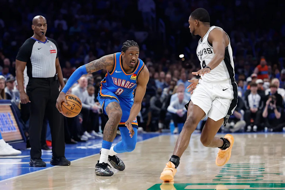 Jan 13, 2026; Oklahoma City, Oklahoma, USA; Oklahoma City Thunder guard/forward Jalen Williams (8) drives down the court beside San Antonio Spurs guard De'aaron Fox (4) during the second half at Paycom Center. Mandatory Credit: Alonzo Adams-Imagn Images