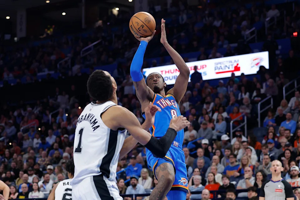 Jan 13, 2026; Oklahoma City, Oklahoma, USA; Oklahoma City Thunder guard/forward Jalen Williams (8) shoots over San Antonio Spurs forward/center Victor Wembanyama (1) during the second half at Paycom Center. Mandatory Credit: Alonzo Adams-Imagn Images
