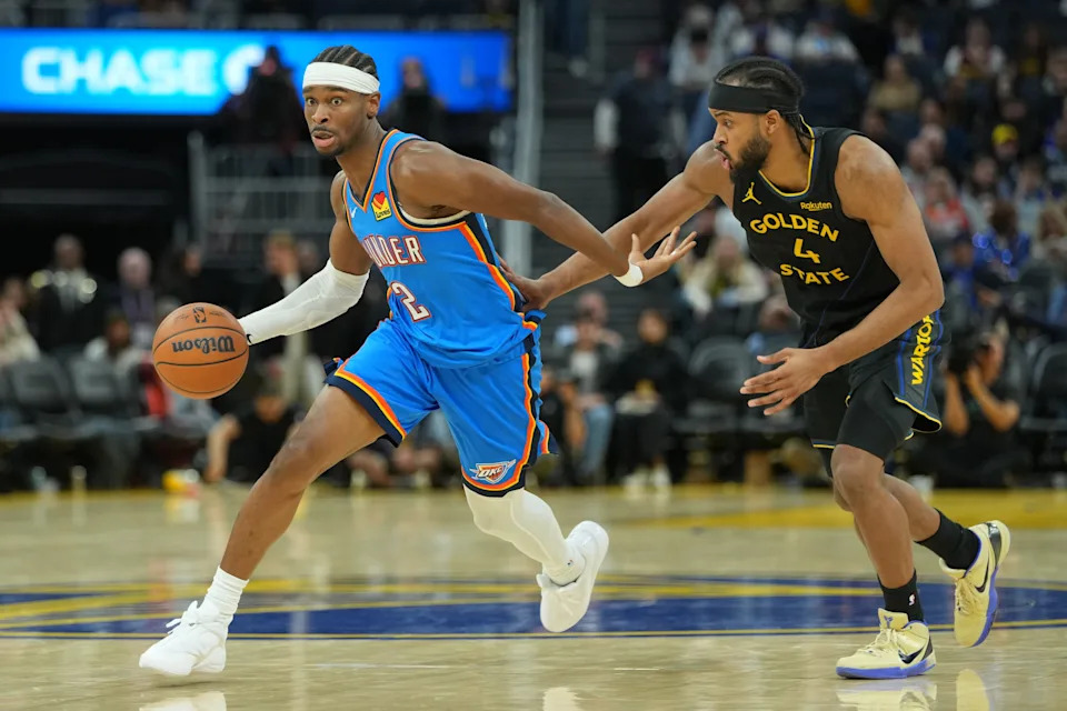 Jan 2, 2026; San Francisco, California, USA; Oklahoma City Thunder guard Shai Gilgeous-Alexander (2) dribbles against Golden State Warriors guard Moses Moody (4) during the third quarter at Chase Center. Mandatory Credit: Darren Yamashita-Imagn Images