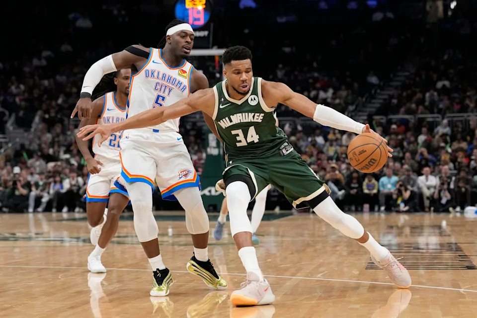 MILWAUKEE, WISCONSIN - JANUARY 21: Giannis Antetokounmpo #34 of the Milwaukee Bucks dribbles the ball against Luguentz Dort #5 of the Oklahoma City Thunder during the fourth quarter at Fiserv Forum on January 21, 2026 in Milwaukee, Wisconsin. NOTE TO USER: User expressly acknowledges and agrees that, by downloading and or using this photograph, User is consenting to the terms and conditions of the Getty Images License Agreement. (Photo by Patrick McDermott/Getty Images)