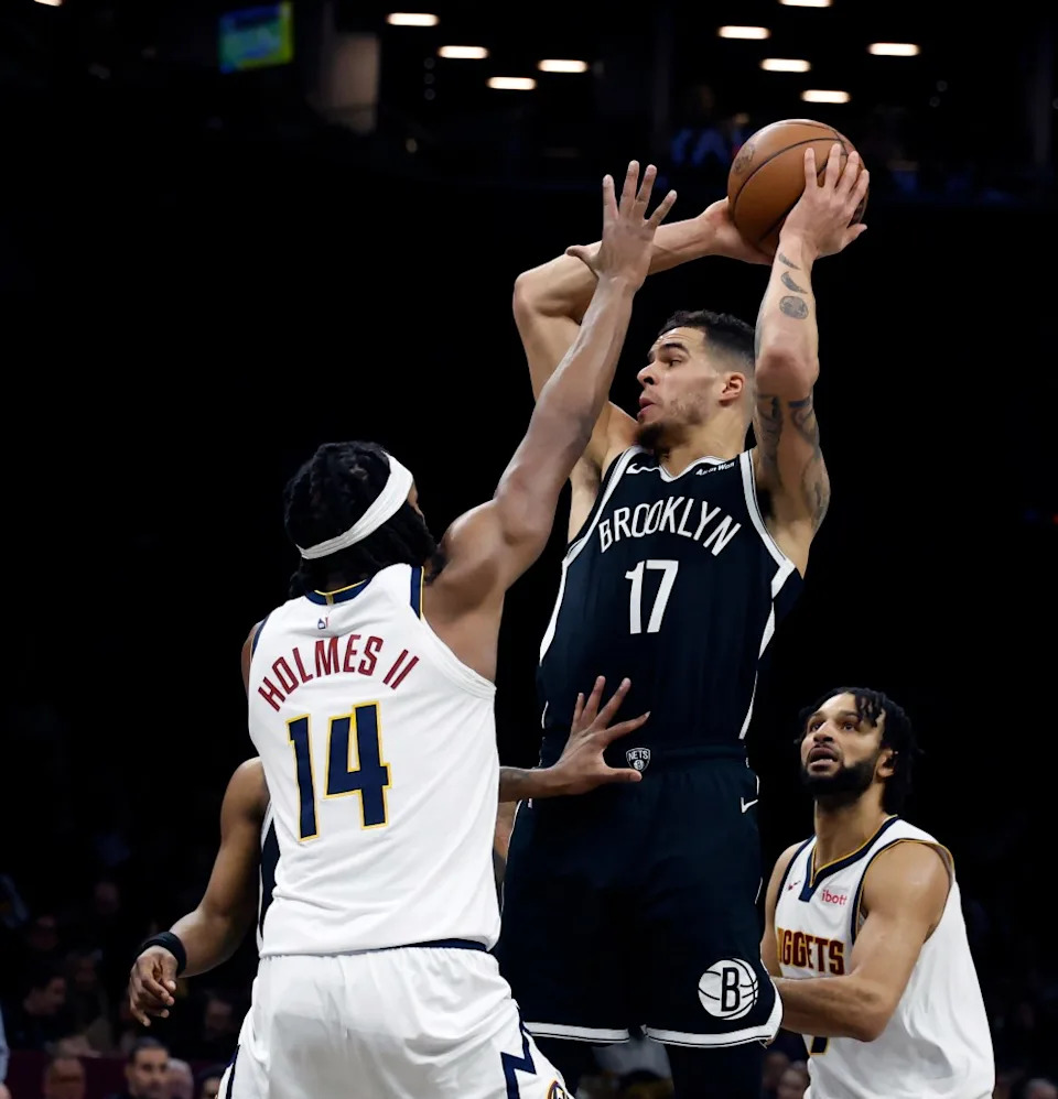 Michael Porter Jr. of the Brooklyn Nets looks for the open man as Daron Holmes II of the Denver Nuggets defends in the second half. The Brooklyn Nets defeat the Denver Nuggets at the Barclays Center in Brooklyn, New York, Sunday, January 04, 2026. JASON SZENES/ NY POST