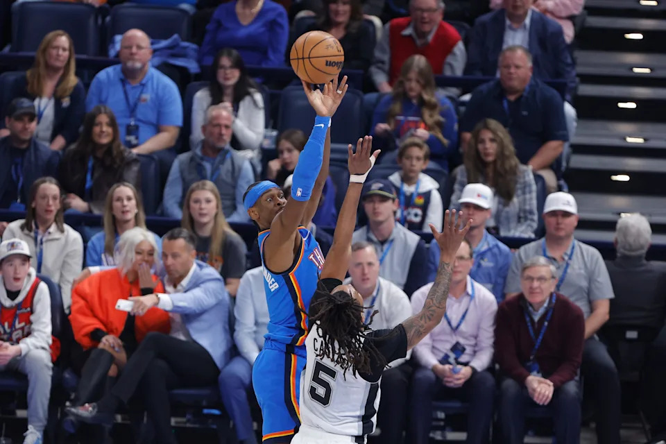 Jan 13, 2026; Oklahoma City, Oklahoma, USA; Oklahoma City Thunder guard Shai Gilgeous-Alexander (2) shoots over San Antonio Spurs guard Stephon Castle (5) during the first quarter at Paycom Center. Mandatory Credit: Alonzo Adams-Imagn Images
