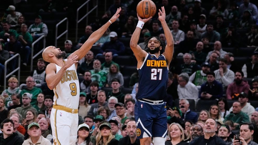 Denver Nuggets guard Jamal Murray (27) shoots against Boston Celtics guard Derrick White (9) during the first half of an NBA basketball game, Wednesday, Jan. 7, 2026, in Boston. (AP Photo/Charles Krupa)