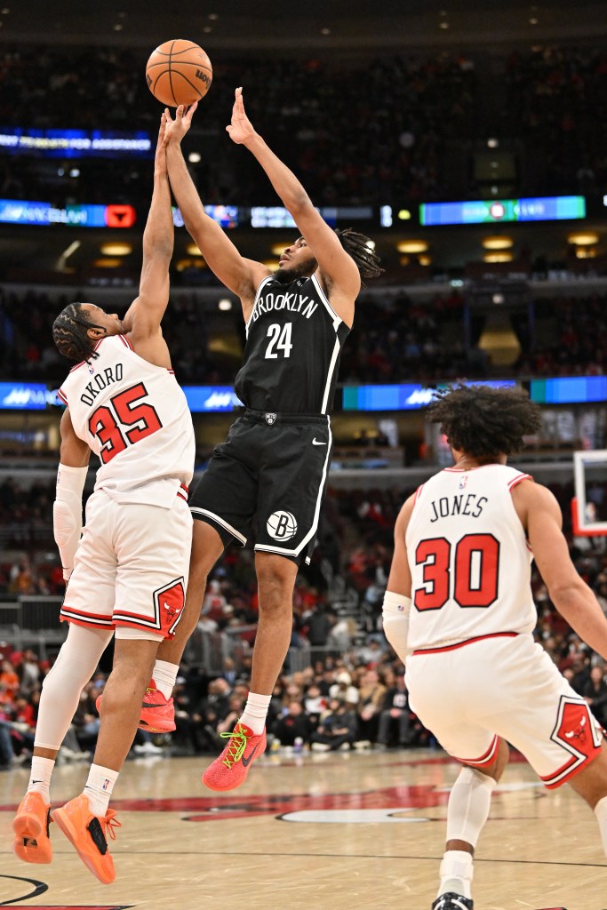 Brooklyn Nets guard Cam Thomas (24) shoots against Chicago Bulls forward Isaac Okoro (35) during the second half at United Center. 