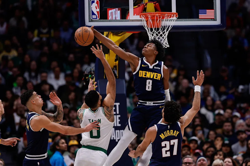 Jan 7, 2025; Denver, Colorado, USA; Denver Nuggets forward Peyton Watson (8) blocks the shot of Boston Celtics forward Jayson Tatum (0) as forward Michael Porter Jr. (1) and guard Jamal Murray (27) defend in the second quarter at Ball Arena. Mandatory Credit: Isaiah J. Downing-Imagn Images