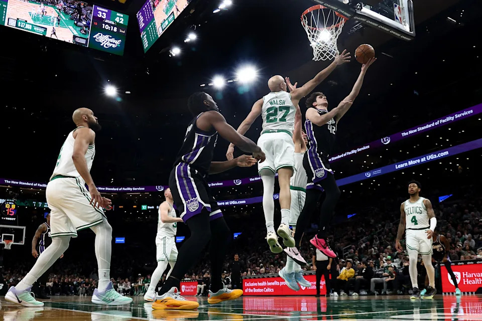 Jan 30, 2026; Boston, Massachusetts, USA; Sacramento Kings center Maxime Raynaud (42) goes to the basket against Boston Celtics guard Jordan Walsh (27) during the second quarter at TD Garden. Mandatory Credit: Winslow Townson-Imagn Images