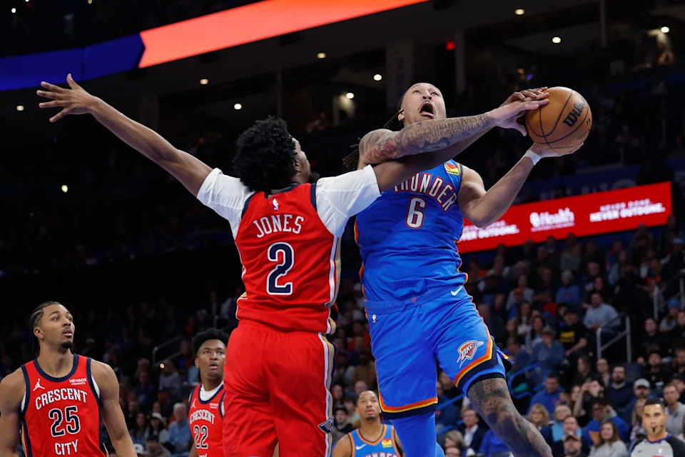 Jan 27, 2026; Oklahoma City, Oklahoma, USA; Oklahoma City Thunder forward Jaylin Williams (6) goes up for a basket as New Orleans Pelicans forward Herbert Jones (2) defends during the second half at Paycom Center. Mandatory Credit: Alonzo Adams-Imagn Images
