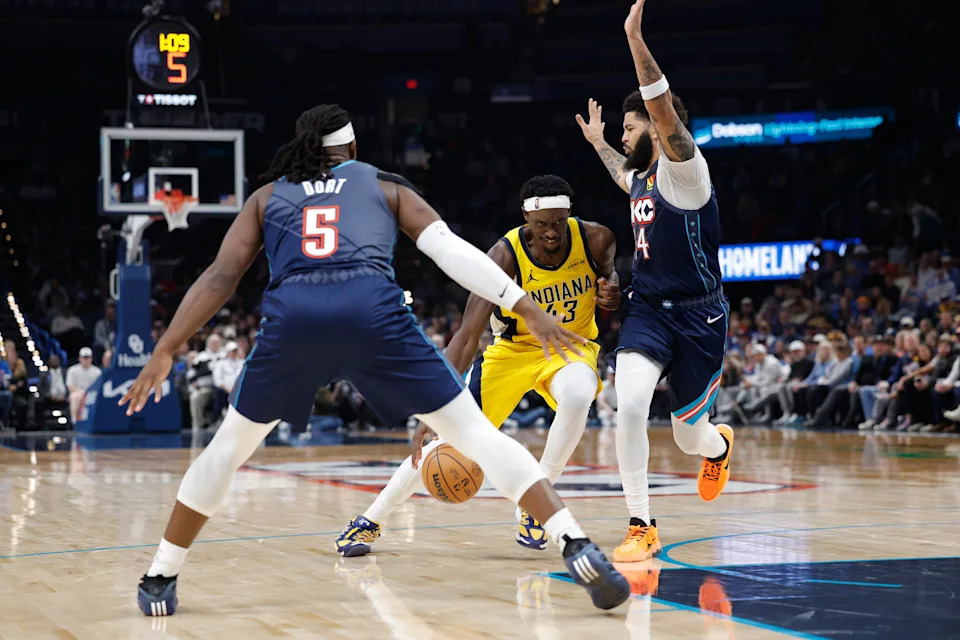 Jan 23, 2026; Oklahoma City, Oklahoma, USA; Indiana Pacers forward Pascal Siakam (43) drives between Oklahoma City Thunder guard/forward Kenrich Williams (34) and guard Luguentz Dort (5) during the second half at Paycom Center. Mandatory Credit: Alonzo Adams-Imagn Images