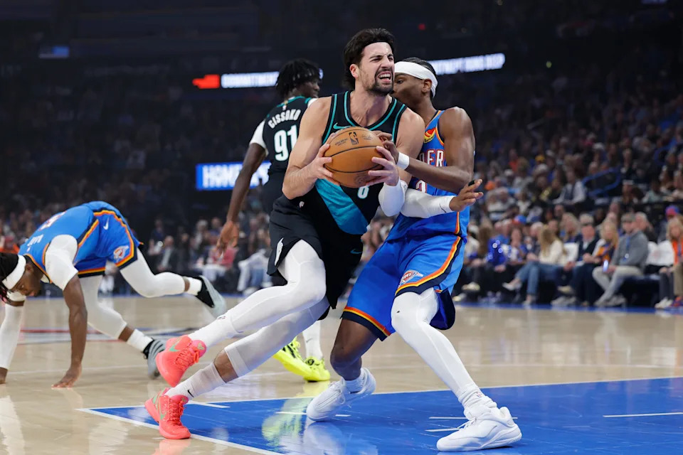 Dec 31, 2025; Oklahoma City, Oklahoma, USA; Portland Trail Blazers forward Deni Avdija (8) drives past Oklahoma City Thunder guard Shai Gilgeous-Alexander (2) during the first quarter at Paycom Center. Mandatory Credit: Alonzo Adams-Imagn Images